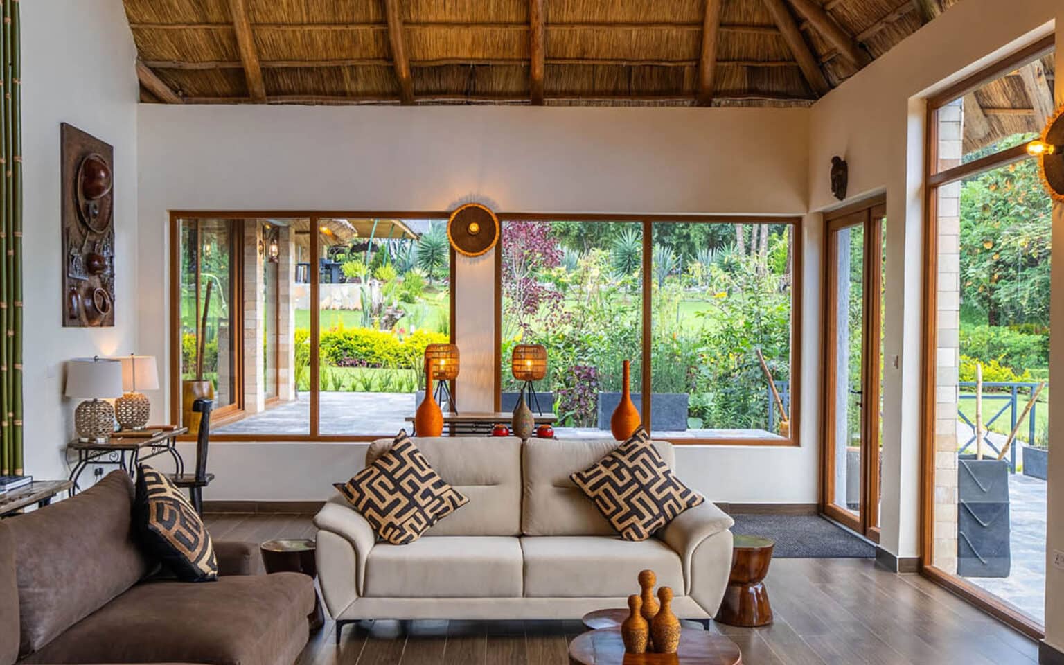 Bright and cozy living room with garden view through large windows