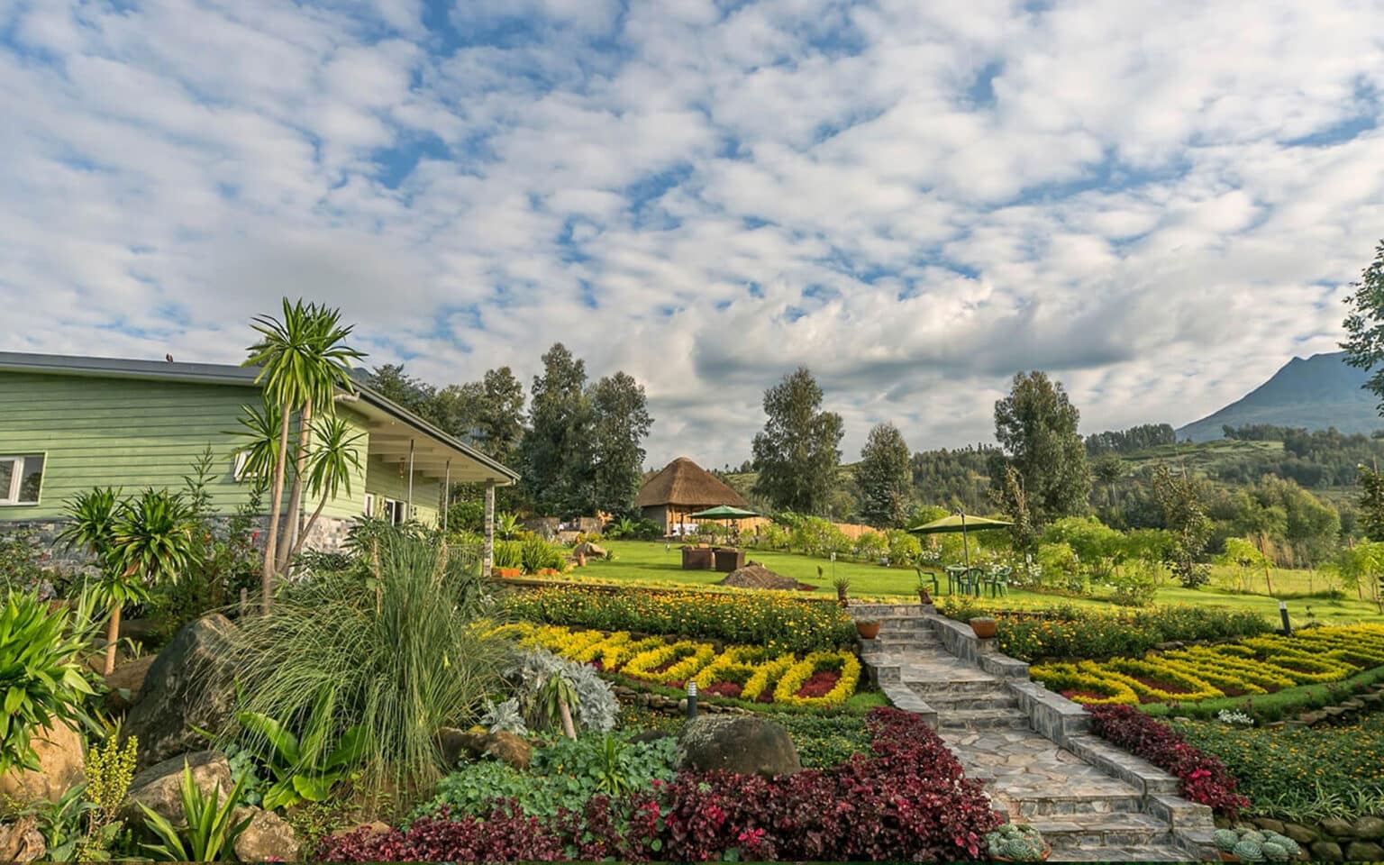 Beautiful garden landscape with pathway and scenic mountain view
