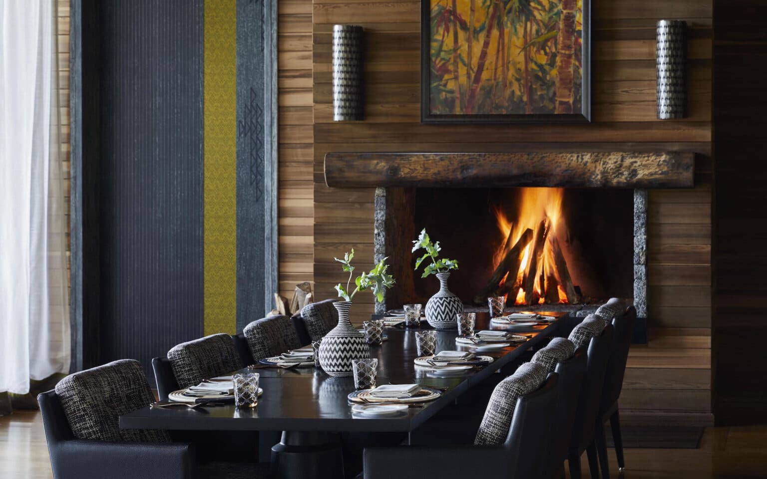 Elegant dining room with fireplace and decorative vases