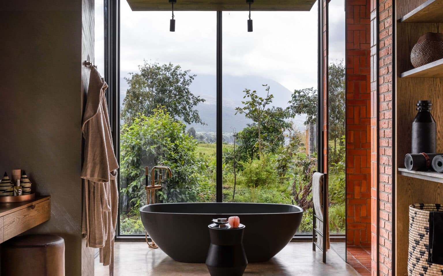Modern bathroom with large window and mountain view