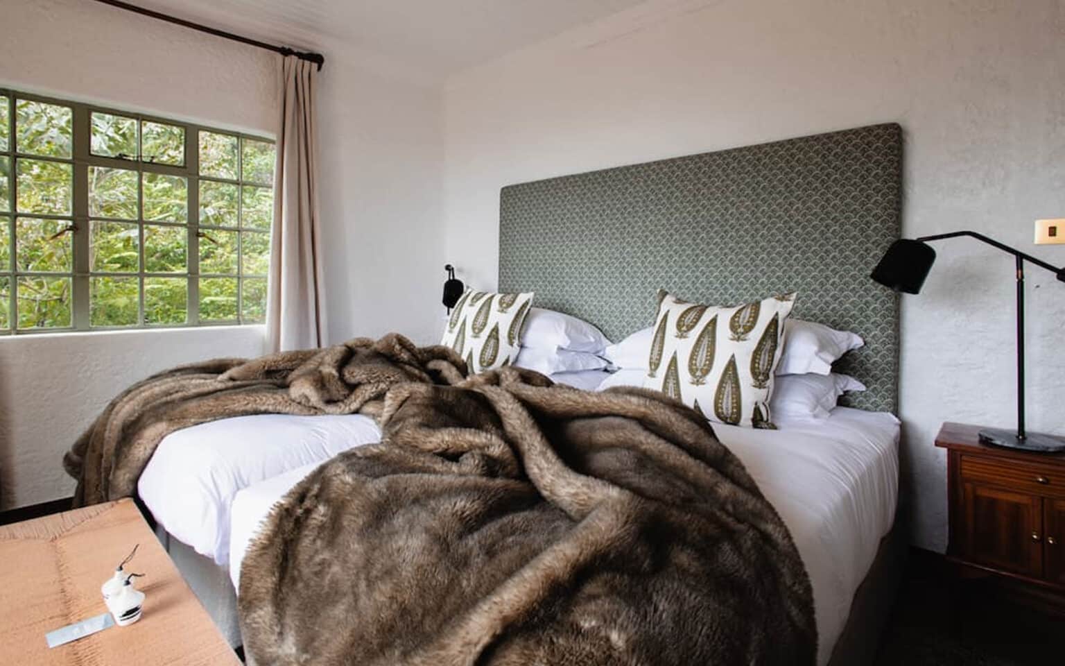 Cozy bedroom with plush bedding and stylish decor