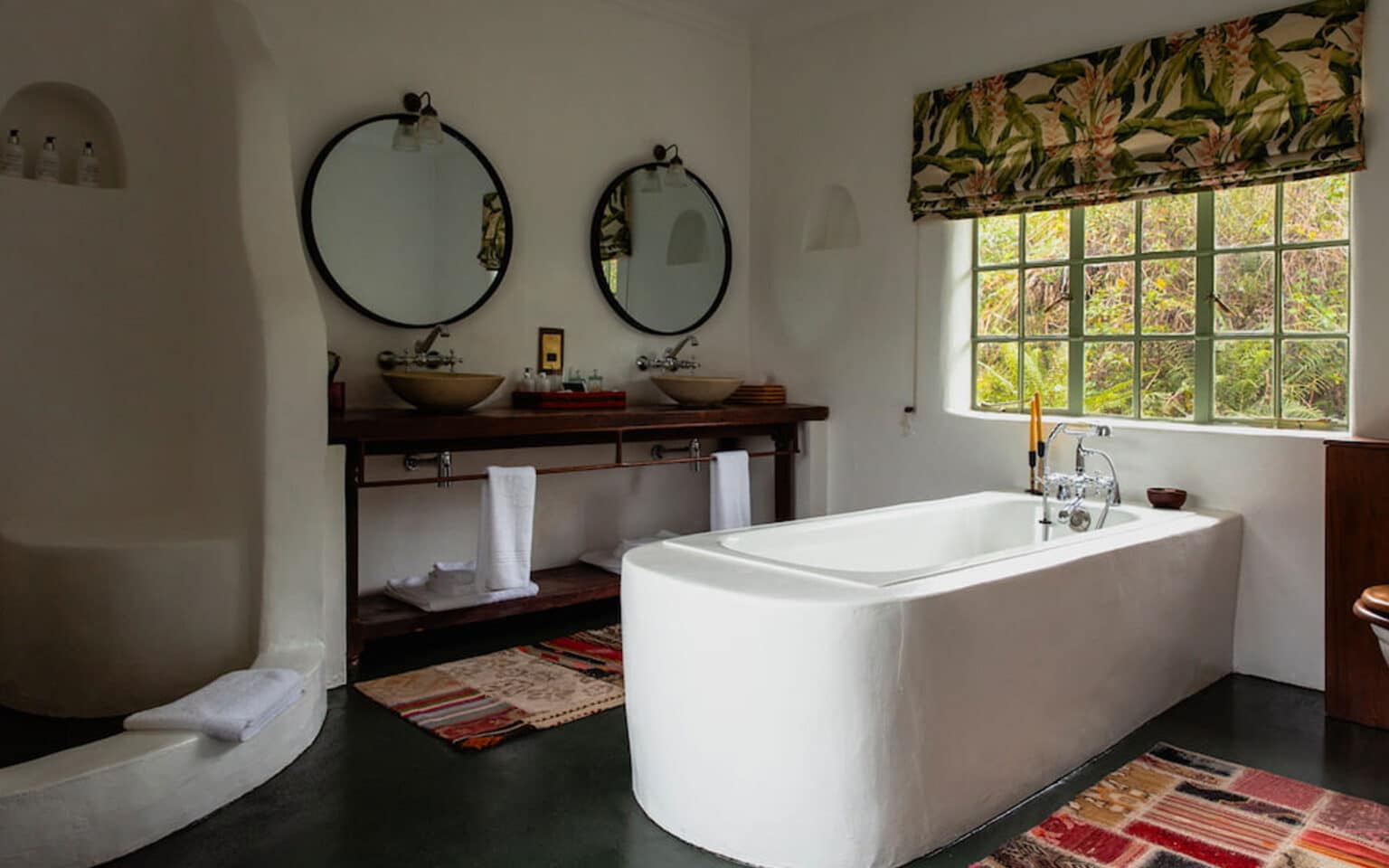 Modern bathroom interior with bathtub and double vanity mirrors